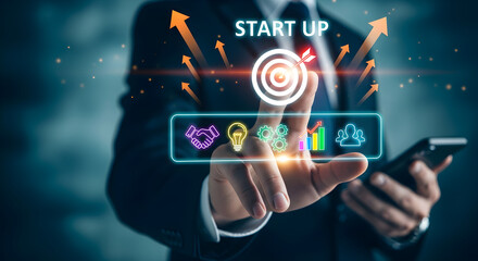 Businessman touching virtual screen with startup text and business icons for success concept