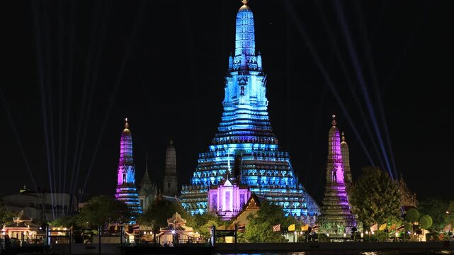 Chao Phraya River Sunset Video Background, see the colorful lights from the spotlights at the 2025 Chao Phraya River Festival, see the beautiful Wat Arun, a world-class tourist attraction.