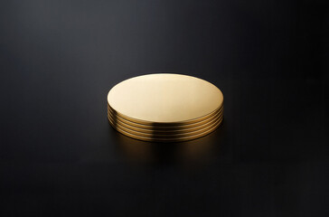 Set of Gold Coasters on Black Background
