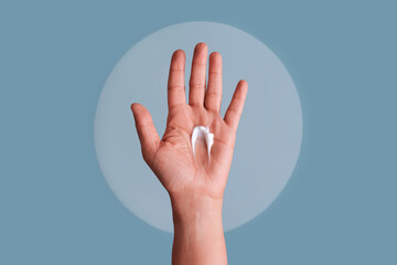 Hand palm holding white cream for skincare