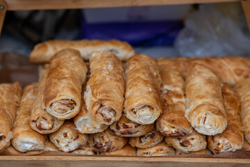 Golden crispy treats, savory baked pastry delights, delicious golden flaked spirals of pastry