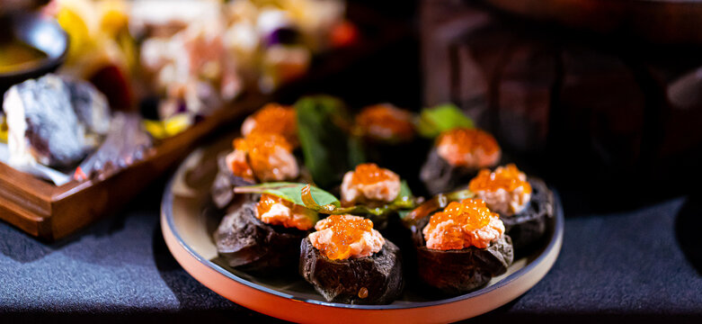 Pumpernickel bread sandwich snack with cured smoked salmon and fresh avocado served as close-up on a wooden cutting board - Powered by Adobe