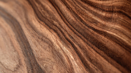 Detailed close-up of rich brown wood grain, showcasing its natural wavy patterns and beautiful texture. An elegant, organic background.