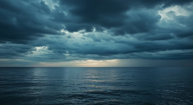 Dark blue sea with dramatic cloudy sky seascape scenery image