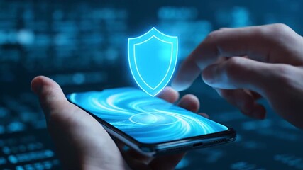 The image shows a man's hands closely holding a mobile phone as he uses a finger to activate a holographic shield icon for online security - Powered by Adobe