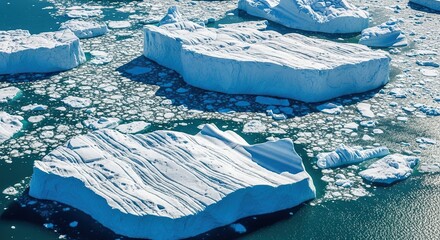 Stunning aerial view of colossal icebergs floating in shimmering arctic waters, perfect for conveying climate change or remote travel destinations