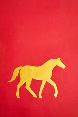 2026 Chinese New Year. Golden Horse shape on red ornate background