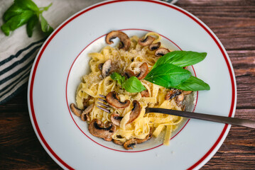Tagliatelle pasta with  parmesan and mushrooms 