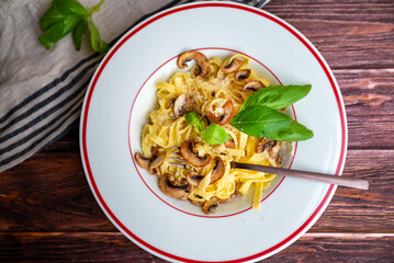 Tagliatelle pasta with  parmesan and mushrooms 