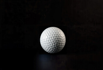 Golf ball on a dark background