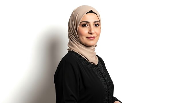Professional Muslim woman smiling confidently representing diversity in business isolated on white background