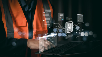 Industrial engineer using laptop with futuristic AI hologram interface. Smart industry 4.0 technology concept. Construction worker analyzing data with artificial intelligence network.