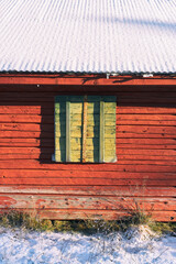 window shutters of an abandoned farmhouse in the hills