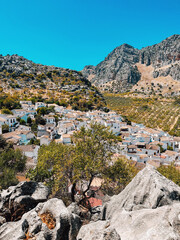 Typical Spanish white village between mountains under a clear blue sky. Montejaque, Granada, Andalusia, Spain.
