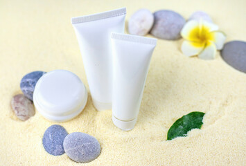 Cosmetics on the spa sea sand. Selective focus.