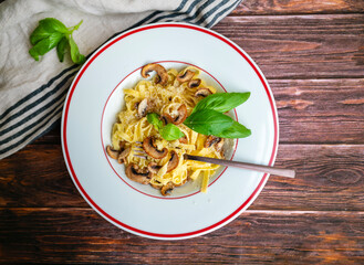 Tagliatelle pasta with  parmesan and mushrooms 
