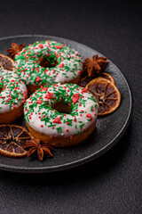 Christmas donuts or doughnuts, holiday winter sweets with sprinkles. Christmas donuts