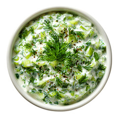 creamy cucumber dill salad in bowl, fresh yogurt herb mixture isolated on white
