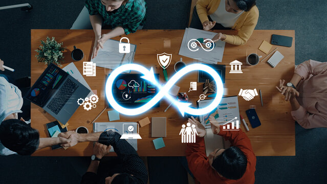 Aerial view of a team engaged in collaborative work with digital icons representing ideas, technology, and growth, creating an innovative atmosphere in an office. Trope