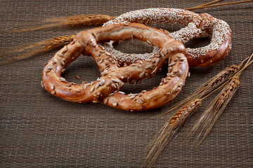 Pretzels with Seeds on Rustic Straw Mat