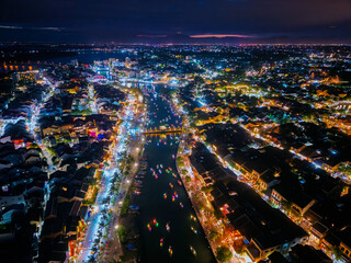 Nighttime aerial view of Hoi An lantern festival on thu bon river, Vietnam