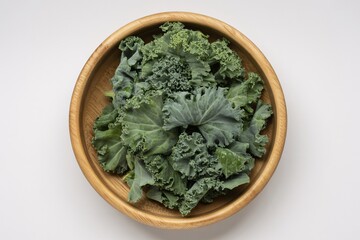 Fresh green kale leaves in wooden bowl healthy eating superfood nutrition diet
