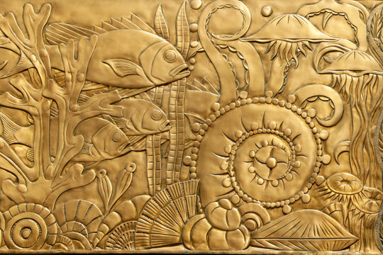 New York City, New York.  Art deco panel detail featuring fish and shells 