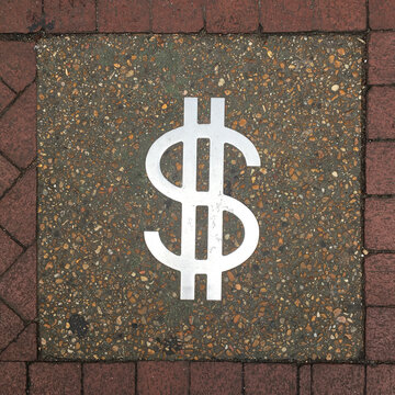 New Orleans, Louisiana, USA. Vintage money sign as seen on a sidewalk in New Orleans.