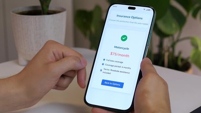 A consumer carefully reads the conditions and cost of specialized motorcycle coverage on his phone. This video highlights the due diligence involved in purchasing insurance and is ideal for content