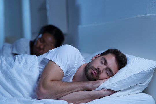Couple sleeping together bedroom night sleep comfort rest bedtime relax - Powered by Adobe