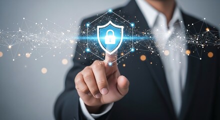 Businessman touching a glowing shield icon representing cybersecurity, data protection, and network security in a digital environment