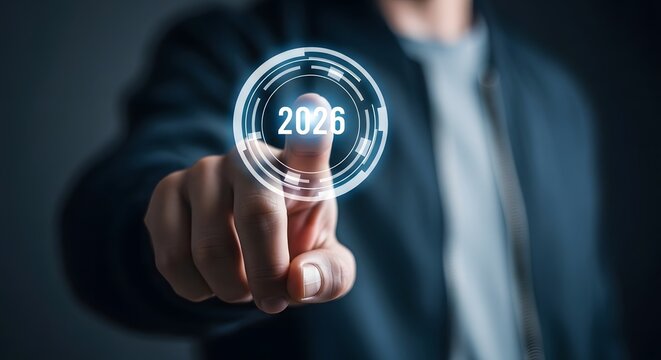 Man touching holographic display with year 2026 representing future technology