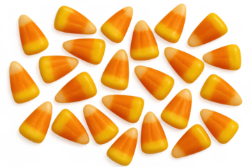 Candy corn pieces scattered, forming a pattern, celebrating halloween and autumn season treats on transparent background