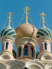 Elaborate domes of orthodox church with blue sky background