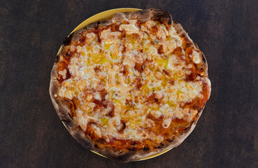 Delicious margherita pizza on yellow plate, top view