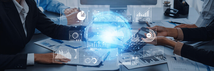 A modern business environment showcasing a team using technology and data visualizations for strategic planning and decision-making amidst charts and reports. Trope