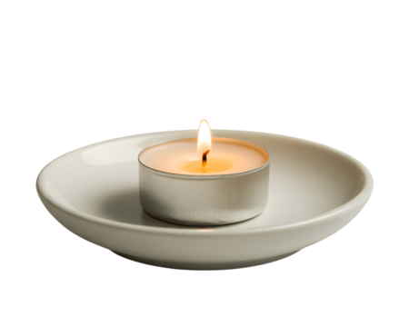 Warm glow of a lit tea light candle on a clean white saucer, isolated against a dark background. Perfect for tranquil, peaceful, and spiritual themes. Evokes relaxation, meditation, warmth, and cal