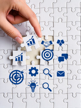 Business development concept. Finding solution to growth. Connecting last jigsaw puzzle piece