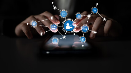 A close-up image depicting hands operating a smartphone with various interactive icons. The graphic represents themes of digital communication and social networking. Tessel