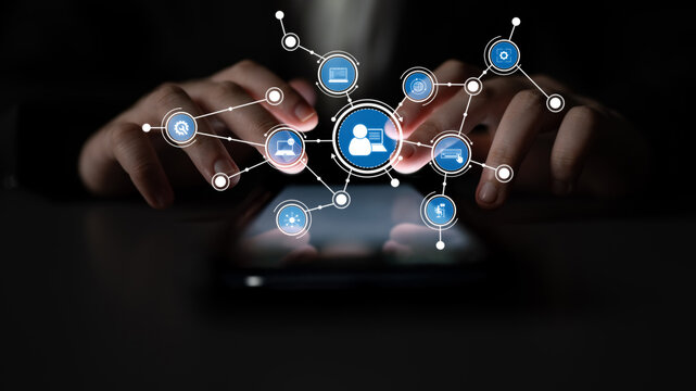 A close-up image depicting hands operating a smartphone with various interactive icons. The graphic represents themes of digital communication and social networking. Tessel - Powered by Adobe
