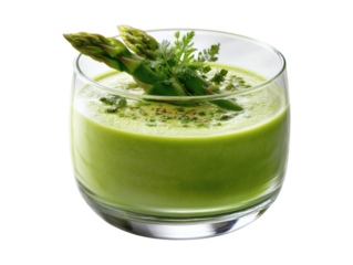 Refreshing green asparagus soup garnished with fresh herbs in a clear glass