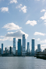 Fototapeta premium Skyscrapers rise along the waterfront under a bright sky in New York City
