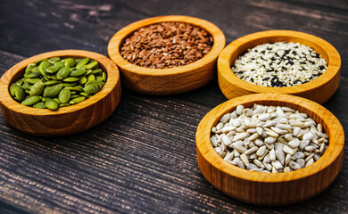 Assortment of Healthy Seeds in Wooden Bowls