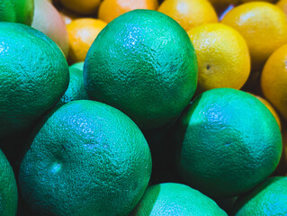 vibrant green and yellow citrus fruit peel texture background close up