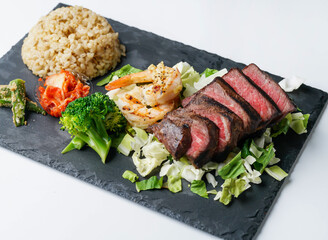 tender steak, juicy shrimp, rice and vibrant vegetables, perfect for healthy recipes and food blog promotions.