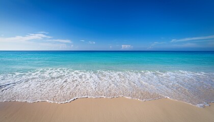 Panoramic View Of Beautiful Turquoise Sea With Waves Gently Lapping Against Sandy Beach Under Clear Blue Sky Serene And Tranquil Scene Evokes Sense Of Peace And Relaxation