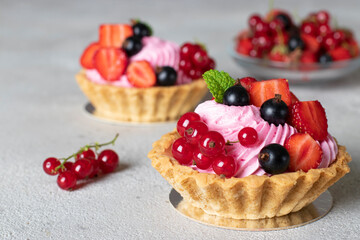 Homemade shortbread baskets with cream and fresh berries