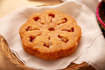 Buñuelos de viento. Traditional food at Christmas and winter holidays in Mexico, these are fried dough flour sprinkled with sugar or covered in a syrup made with piloncillo, cinnamon, and guava.