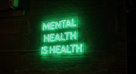 Vibrant green neon sign declaring 'Mental Health is Health' on a textured brick wall, radiating awareness and hope for wellness initiatives