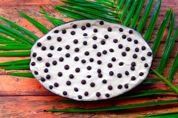 Traditional exotic cupuaçu mousse and cupuaçu cream, with chocolate chips, a sweet dessert from the Brazilian Amazon region.